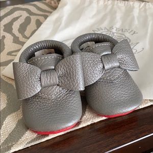 Gray Baby moccasins. Red sole.